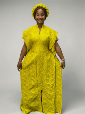 Citron green 3D floral gown with raised floral texture and adjustable waist ties on grey studio background