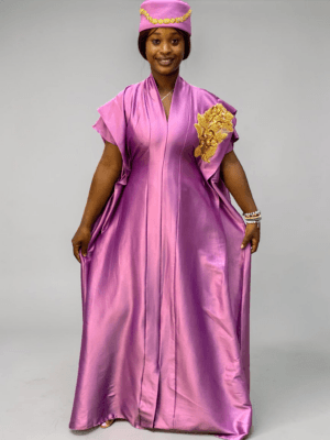 Orchid purple satin boubou gown with embellished shoulder detail and adjustable waist ties on grey studio background