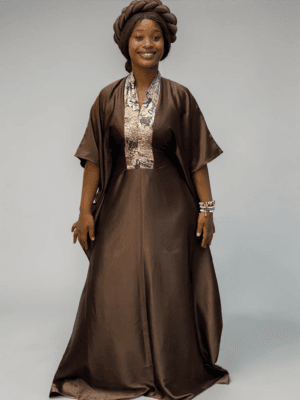 Chocolate brown satin boubou gown with brocade neckline trim and adjustable waist ties on grey studio background
