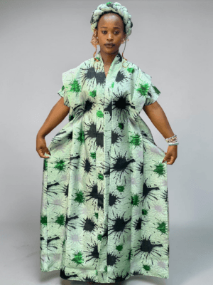 Mint green brocade gown with black and green ink-inspired pattern and adjustable waist ties on grey studio background