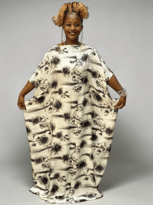 Ivory and black ink floral printed satin kaftan with adjustable waist ties on grey studio background