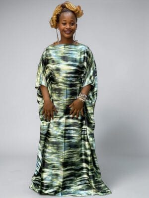 Sage charcoal and cream printed satin kaftan with adjustable waist ties on a grey studio background